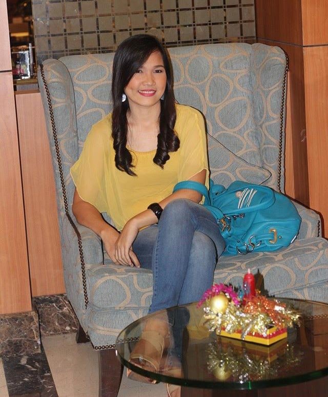A girl with a yellow blouse.